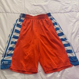 Nike Boys red shorts with side white and blue horizontal stripes size small